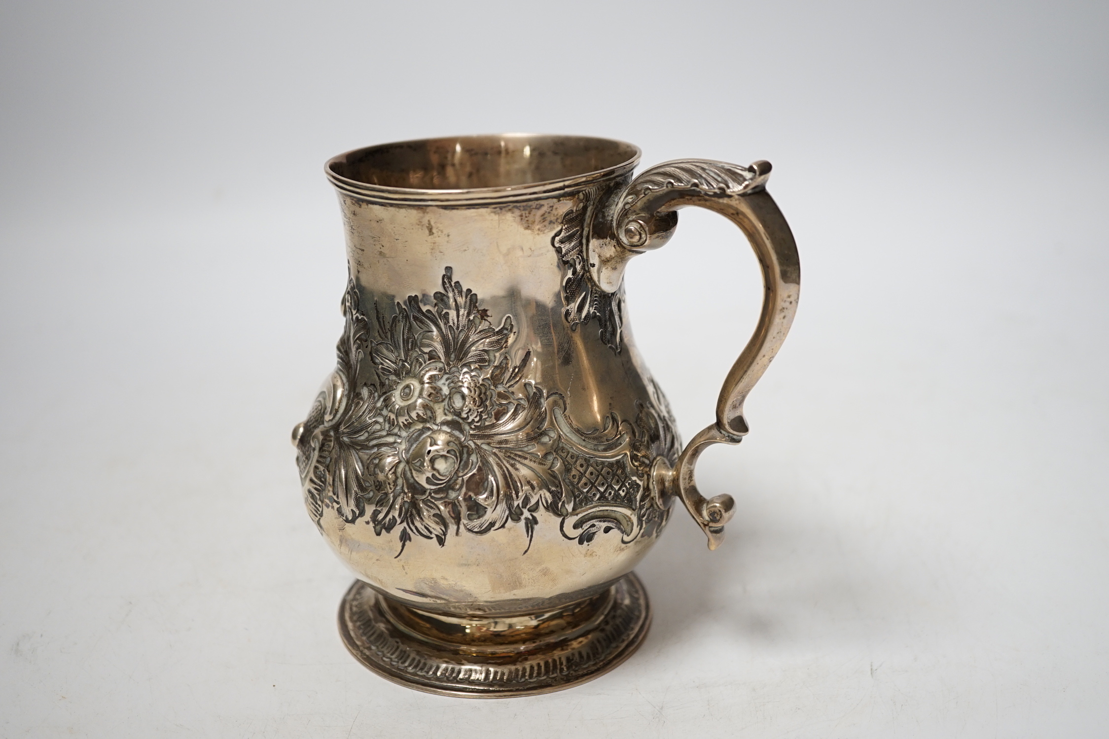 A Victorian embossed silver baluster mug, Charles Boyton II, London, 1866?, height 13cm, 8.6oz.